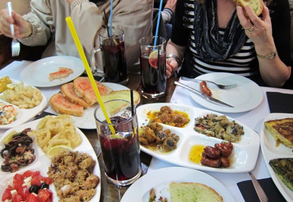 Tapas - Notice the Octopus on the left and the enormous glasses of sangria complete with the longest straw in the world